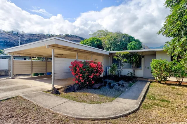 a front view of a house with garden