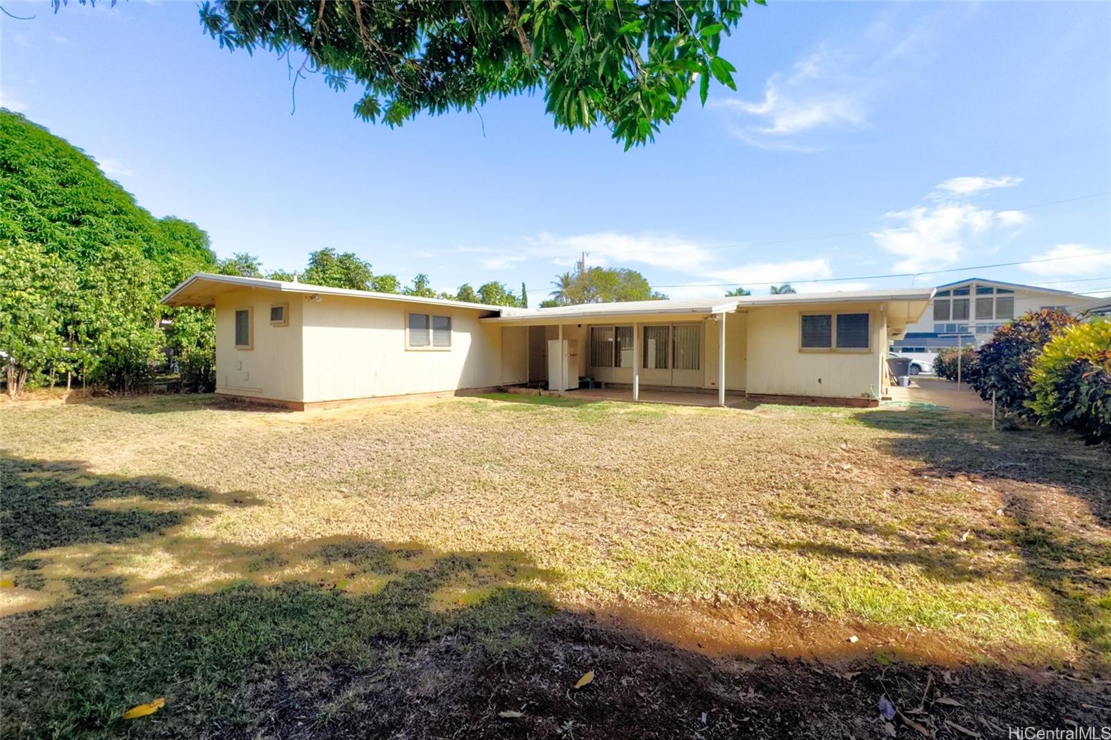 5558 Pia Street Honolulu, HI 96821 - Photo 16 of 25 a view of a house with a yard
