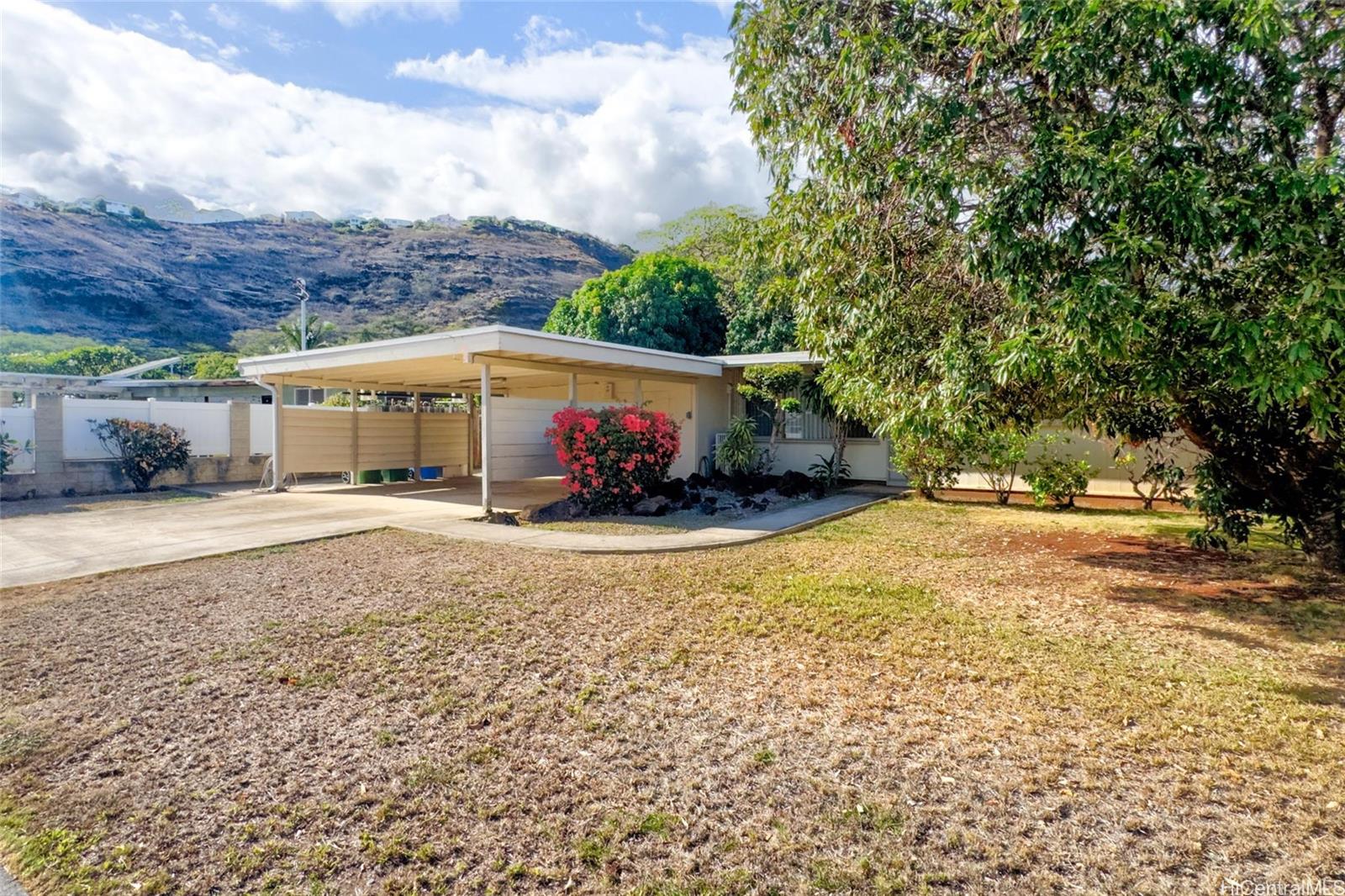 5558 Pia Street Honolulu, HI 96821 - Photo 20 of 25 a front view of a house with a yard