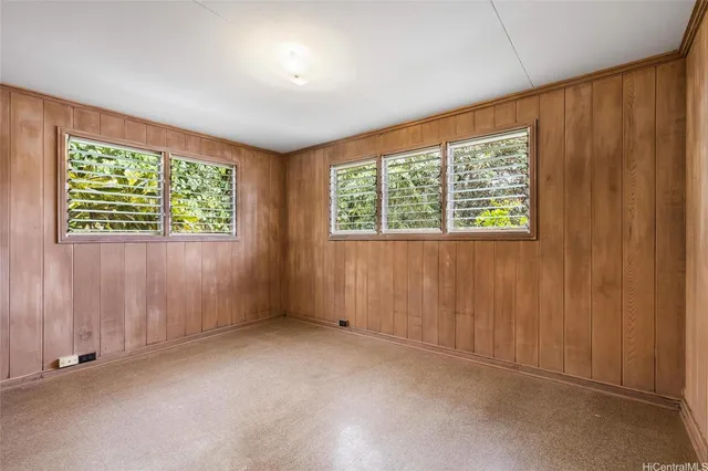 a spacious bathroom with a tub sink and mirror