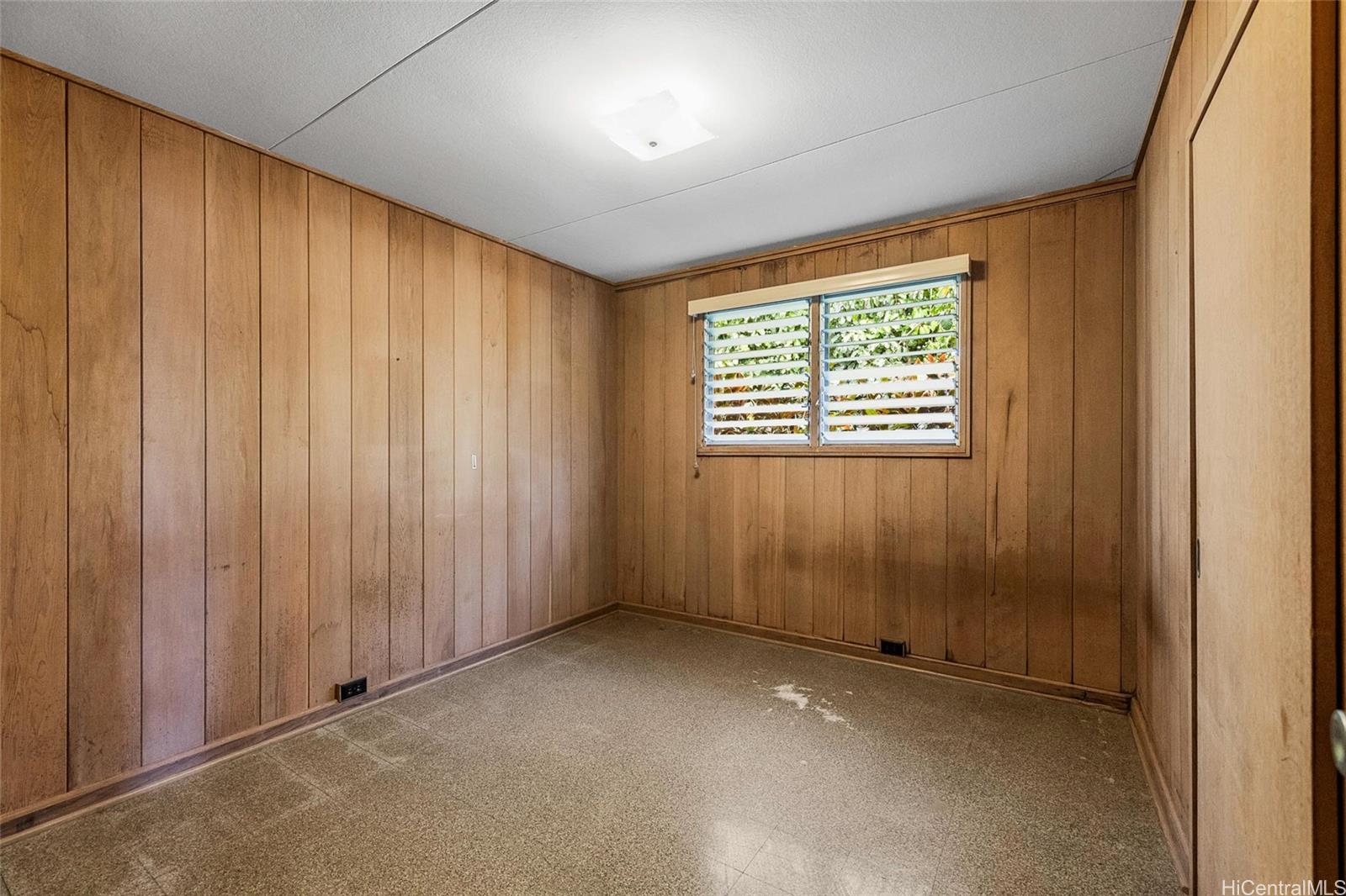 5558 Pia Street Honolulu, HI 96821 - Photo 6 of 25 an empty room with windows