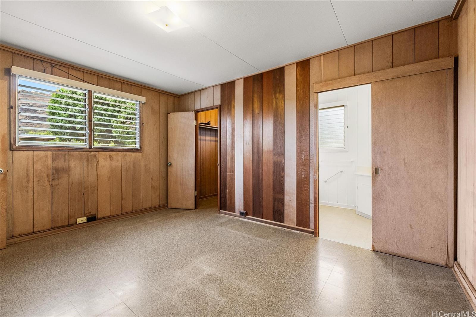 5558 Pia Street Honolulu, HI 96821 - Photo 9 of 25 an empty room with windows