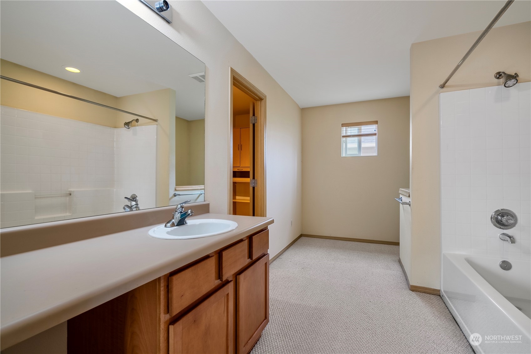 15513 38th Drive Southeast Bothell, WA 98012 - Photo 21 of 25 a bathroom with a sink a tub and a mirror