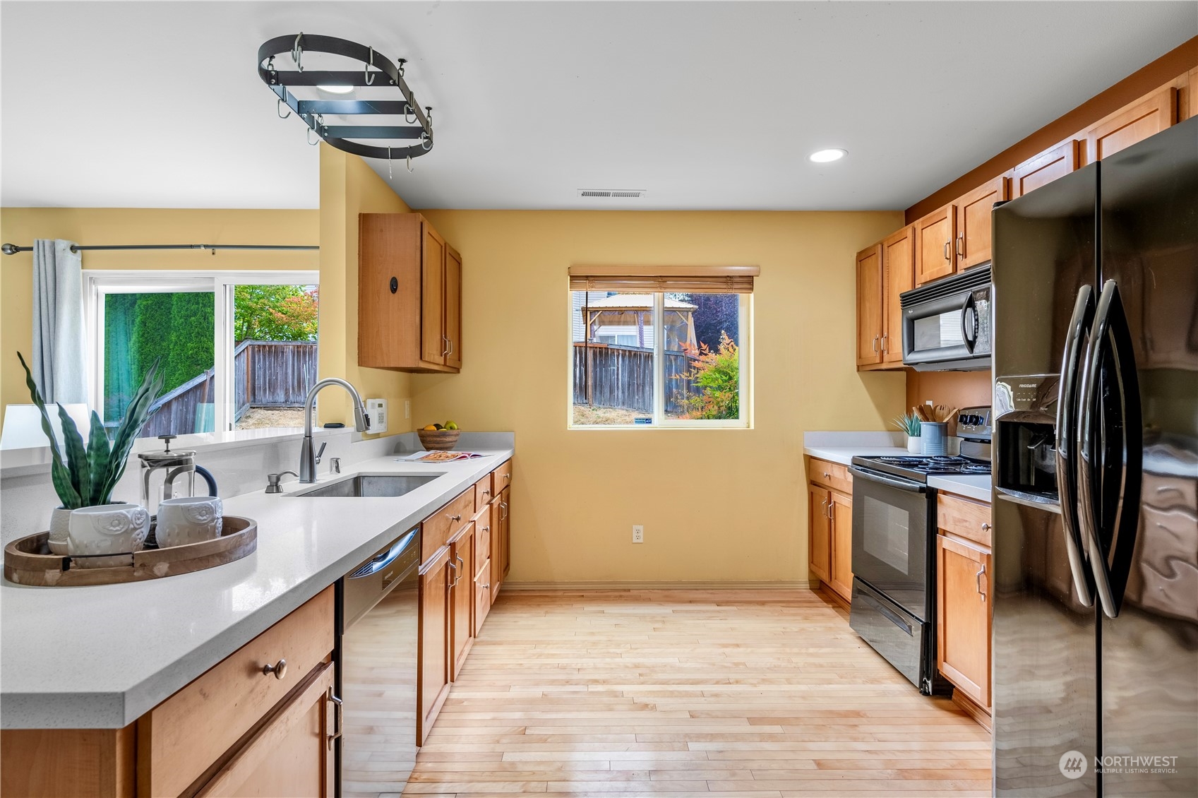 15513 38th Drive Southeast Bothell, WA 98012 - Photo 6 of 25 a kitchen with stainless steel appliances granite countertop a sink a stove and a refrigerator