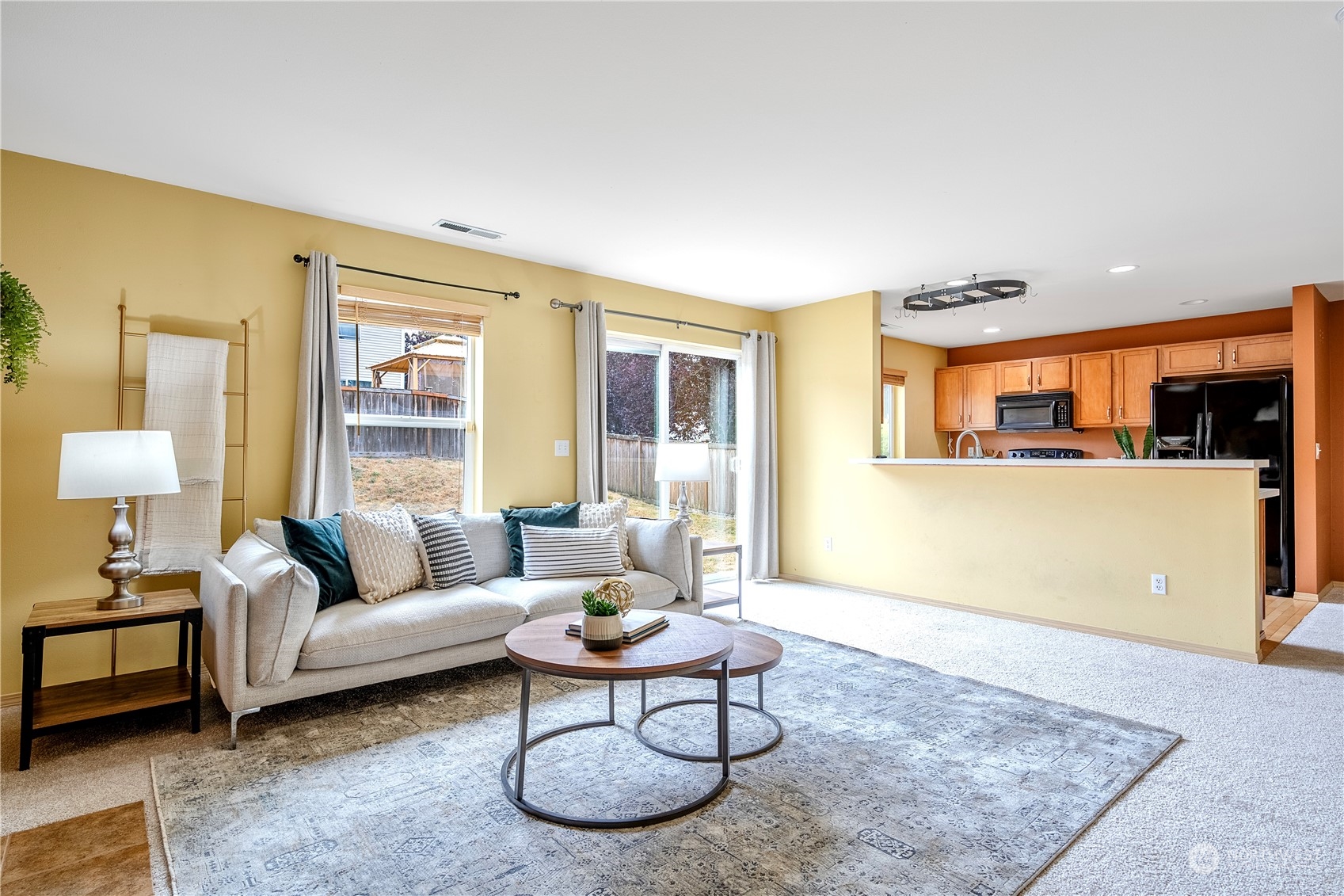 15513 38th Drive Southeast Bothell, WA 98012 - Photo 10 of 25 a living room with furniture a rug and a large window