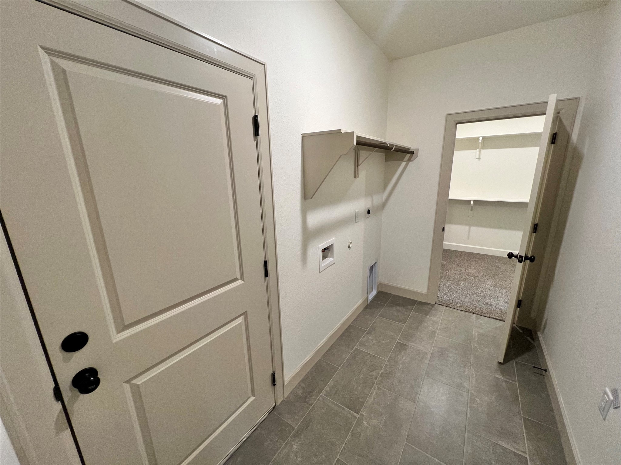 1003 South Anderson Street Angleton, TX 77515 - Photo 11 of 20 a view of walk in closet with wooden floor