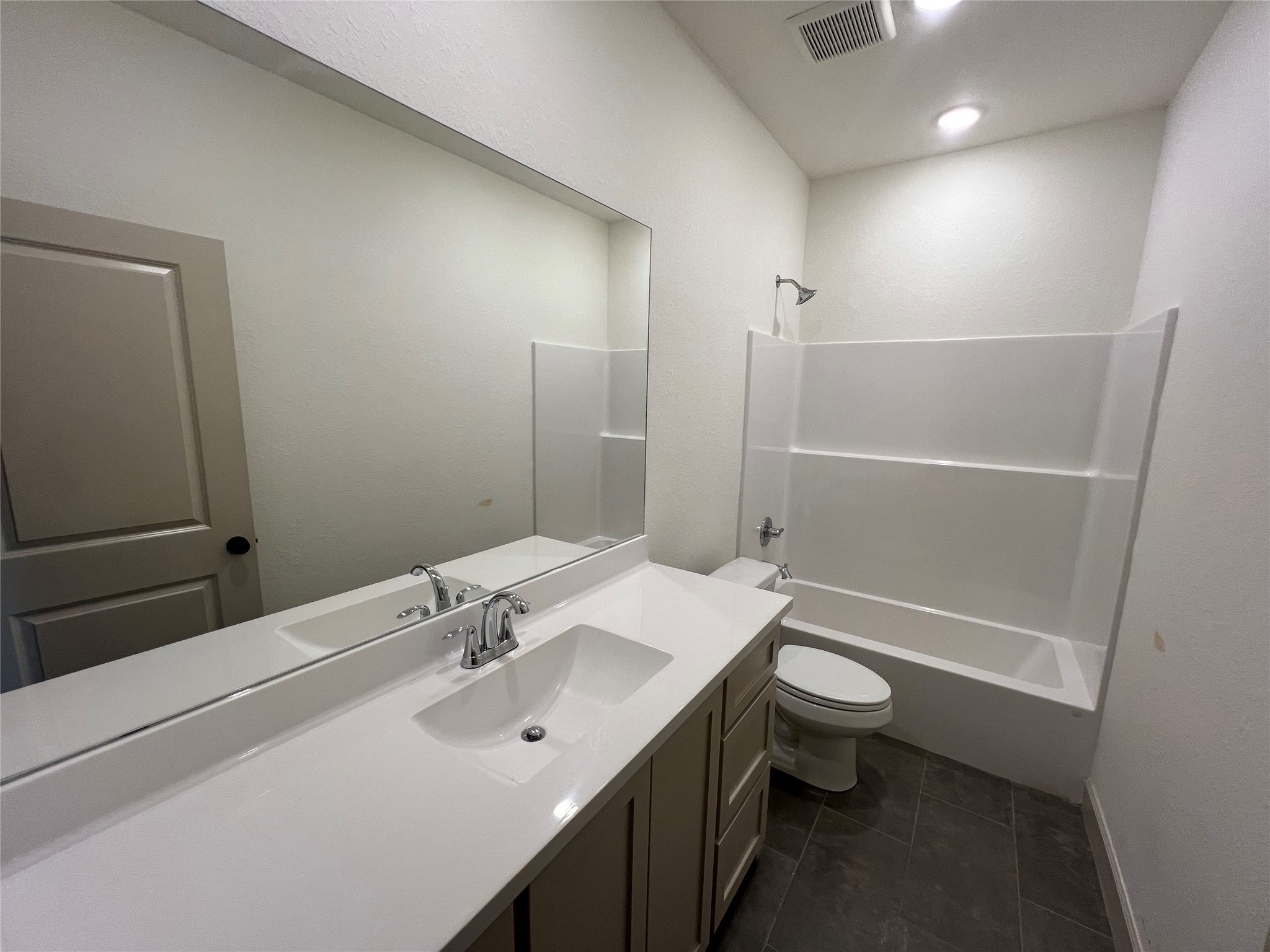 1003 South Anderson Street Angleton, TX 77515 - Photo 12 of 20 a bathroom with a sink a toilet and shower