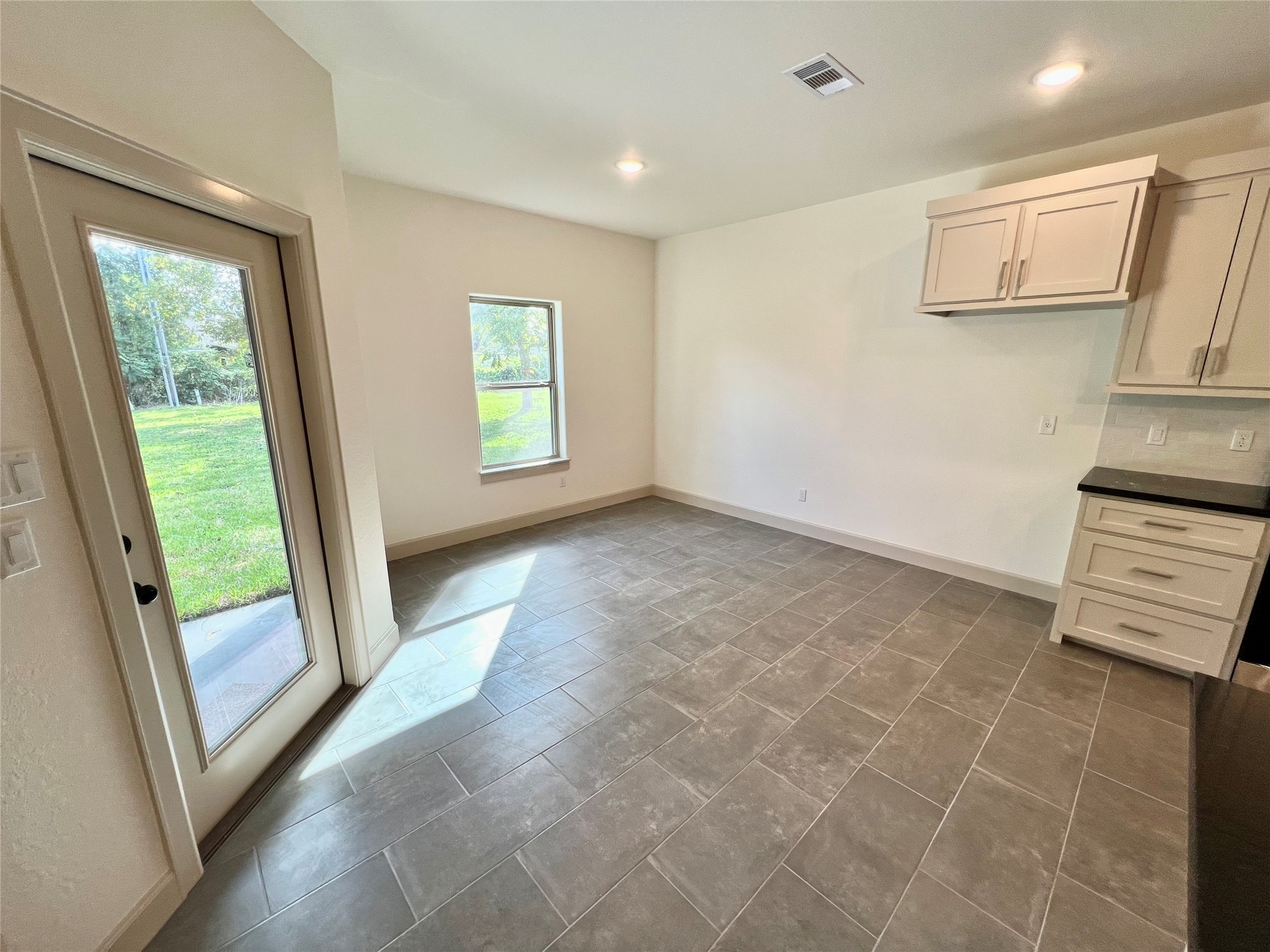 1003 South Anderson Street Angleton, TX 77515 - Photo 8 of 20 a view of an empty room with a window