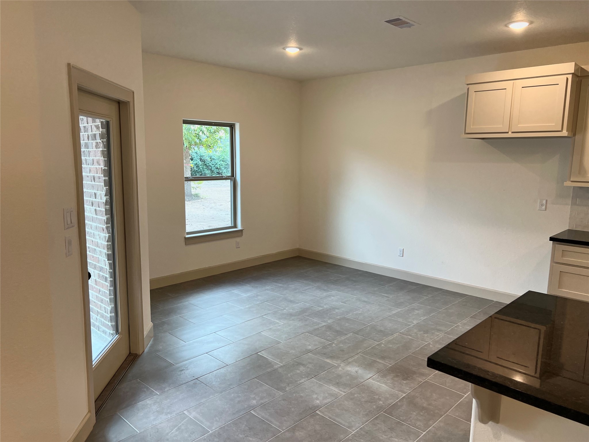 1003 South Anderson Street Angleton, TX 77515 - Photo 9 of 20 an empty room with windows
