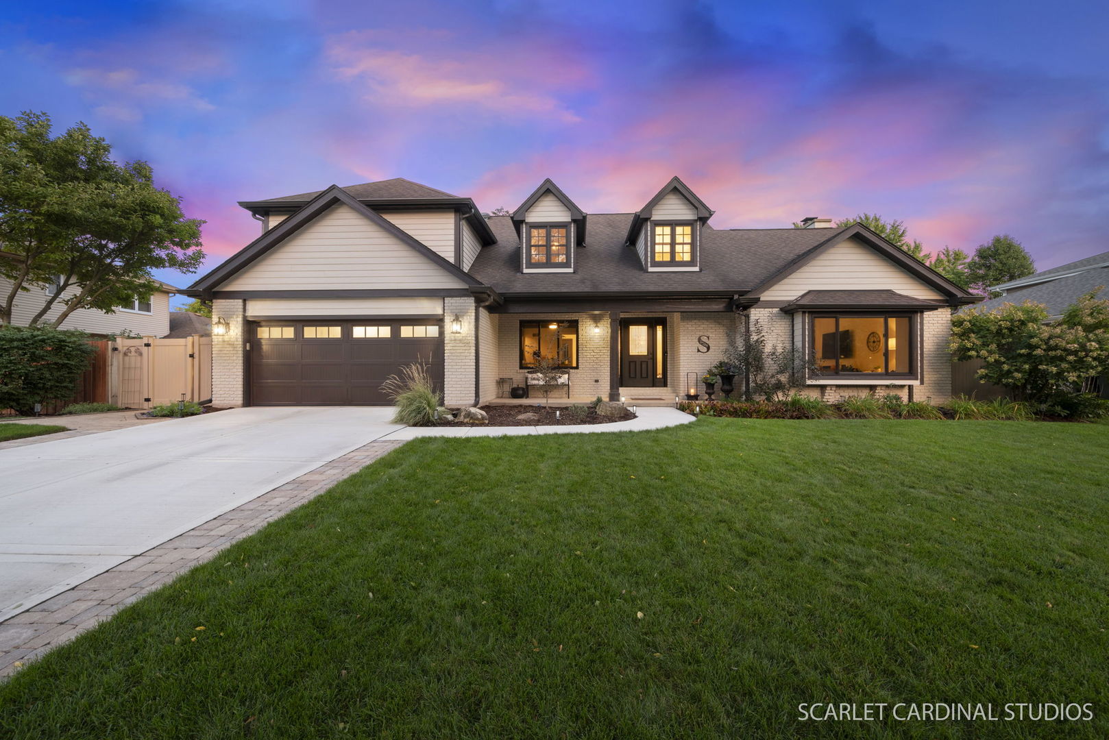 a front view of a house with a yard