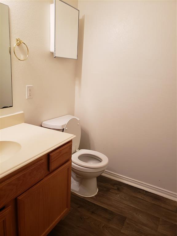 13631 Biggs Street Dallas, TX 75253 - Photo 16 of 17 a bathroom with a toilet and a sink