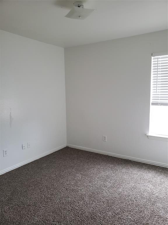 13631 Biggs Street Dallas, TX 75253 - Photo 6 of 17 an empty room with a window