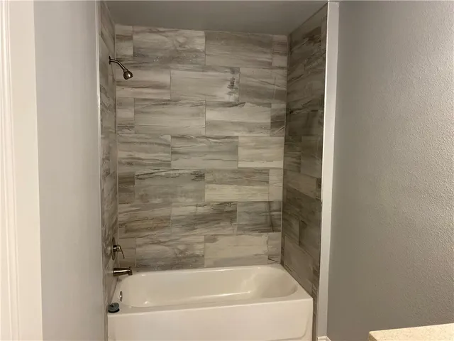 a close up of a bathtub in a bathroom
