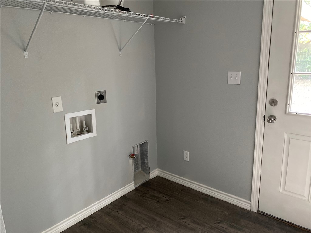 6107 Carnation Terrace Austin, TX 78741 - Photo 23 of 27 a view of an empty room with wooden floor and a window