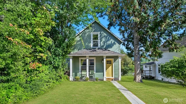 a front view of a house with a yard