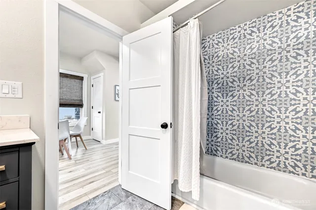 a bathroom with a bathtub and a shower