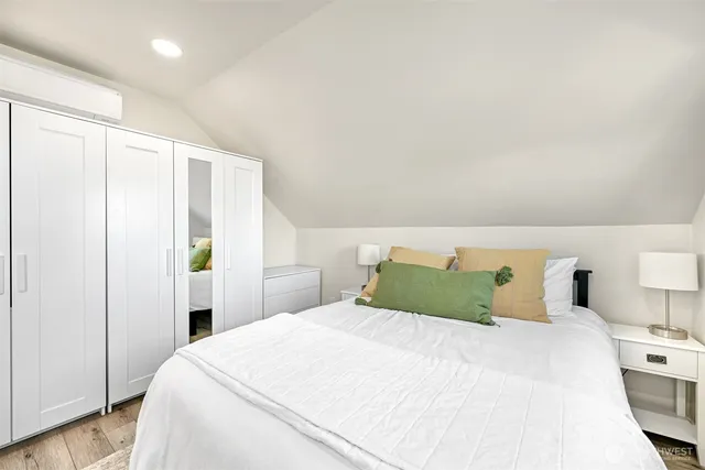 a bedroom with a bed and a closet