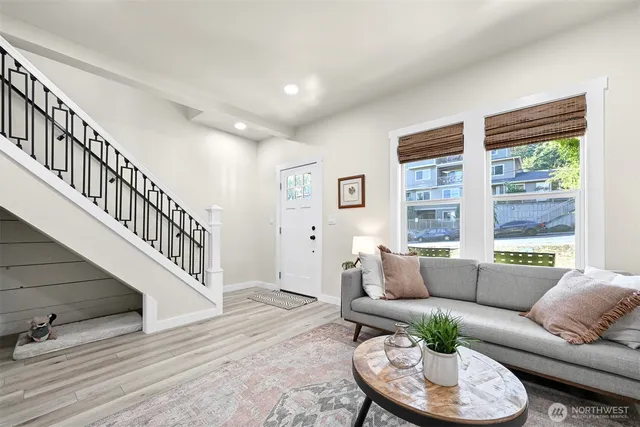 a living room with furniture and a large window