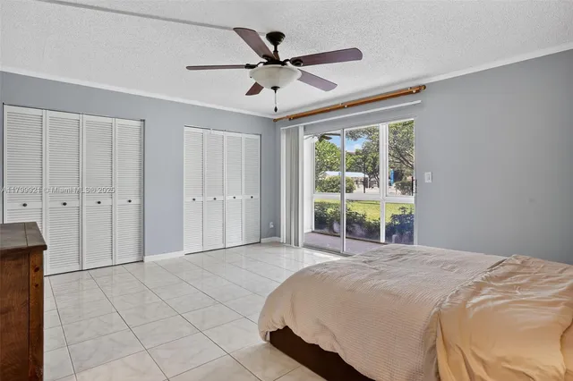 an aerial view of a house with a lake view