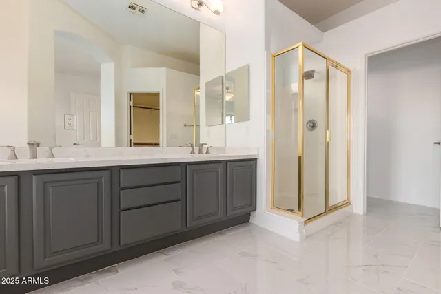 a bathroom with a double vanity sink mirror and double
