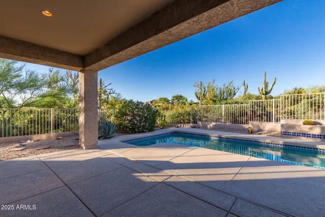 a view of swimming pool from a balcony