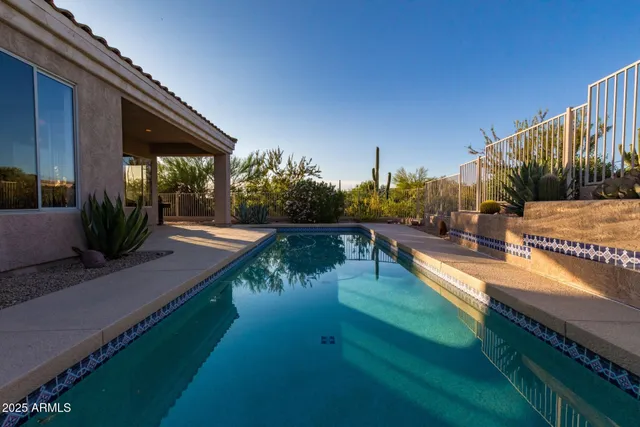 a view of a swimming pool with a patio