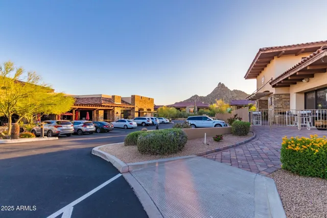 a city street lined with buildings and cars parked