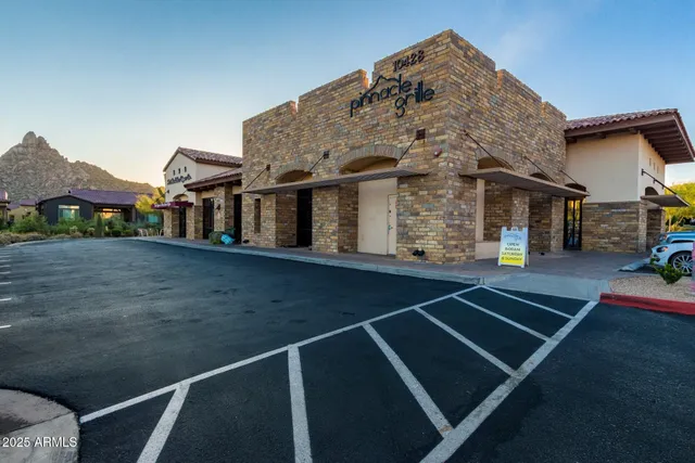 a front view of a house with parking space