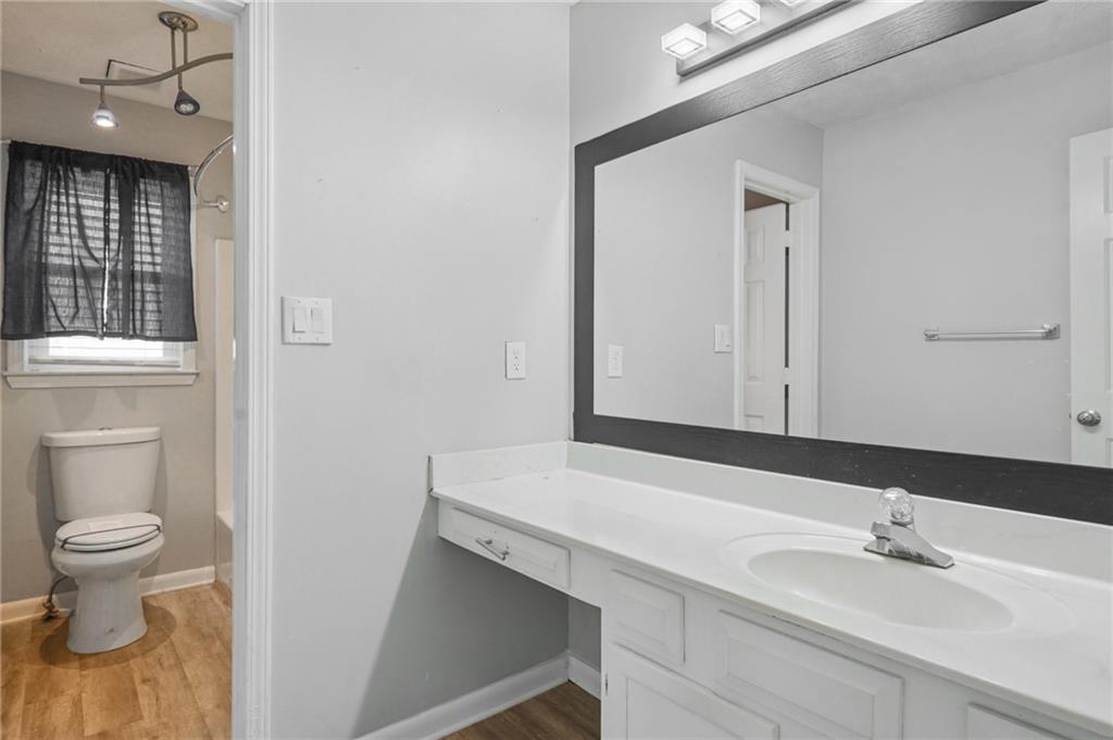 1145 Christian Circle Southeast Conyers, GA 30013 - Photo 15 of 18 a bathroom with a sink and a mirror