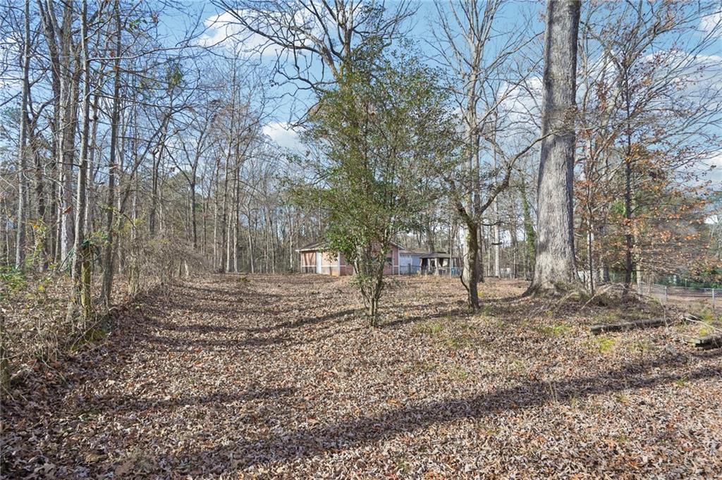 1145 Christian Circle Southeast Conyers, GA 30013 - Photo 17 of 18 a view of a yard with large trees