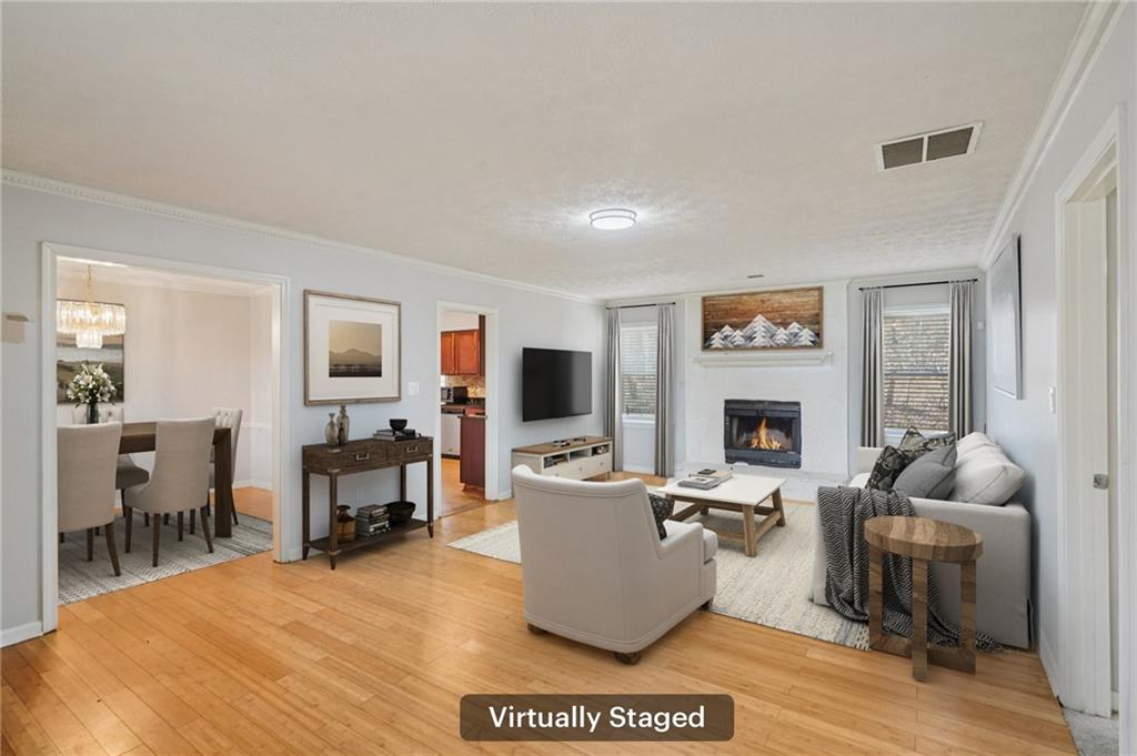 1145 Christian Circle Southeast Conyers, GA 30013 - Photo 2 of 18 a living room with furniture a fireplace and a flat screen tv