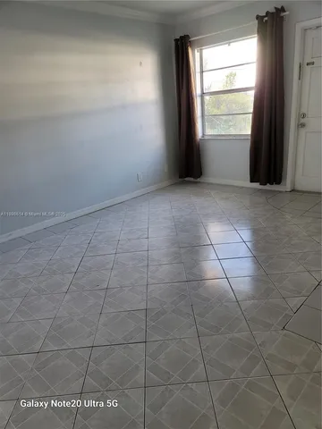 a view of an empty room and window