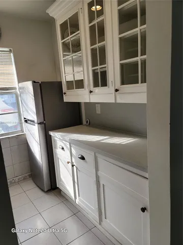 a view of cabinets and window