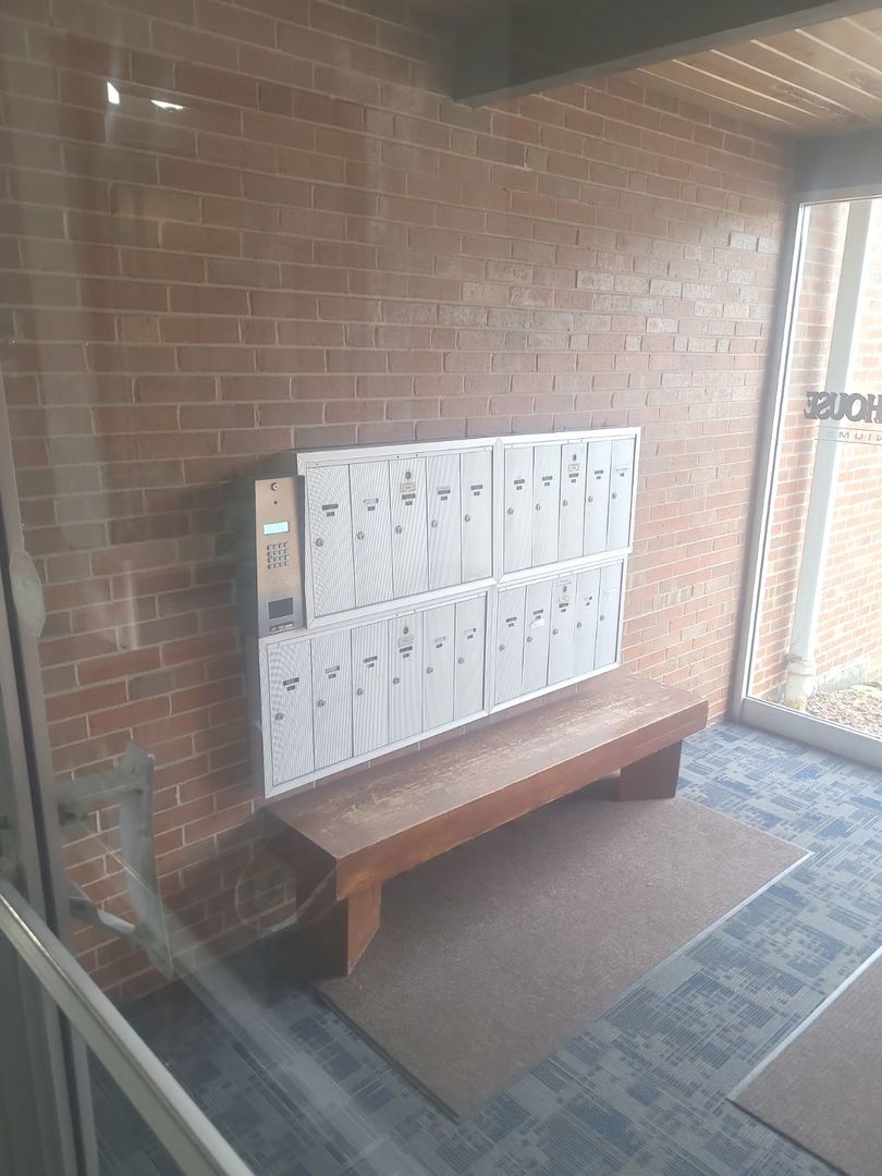 2215 West 111th Street, Unit 101 Chicago, IL 60643 - Photo 3 of 39 a view of wooden cabinet