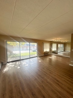 2215 West 111th Street, Unit 101 Chicago, IL 60643 - Photo 4 of 39 a view of empty room with wooden floor