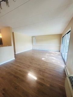 2215 West 111th Street, Unit 101 Chicago, IL 60643 - Photo 5 of 39 a view of an empty room with wooden floor