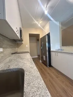 a bathroom with a sink and a large mirror