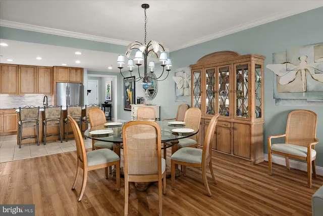 a spacious bedroom with a bed a couch and a window