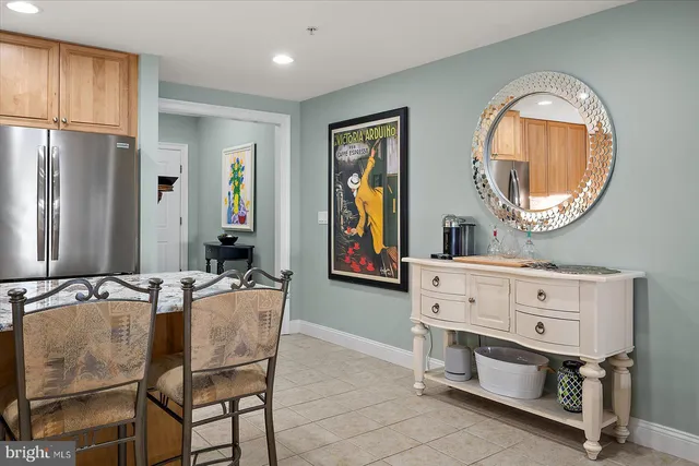 a bedroom with two beds and painting on the wall