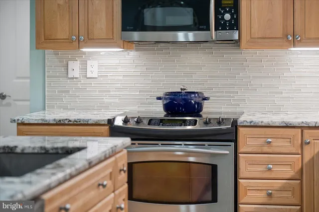 a living room with furniture a rug and a chandelier