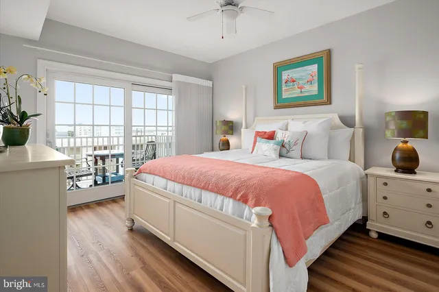 a kitchen with stainless steel appliances kitchen island granite countertop a table chairs sink and microwave