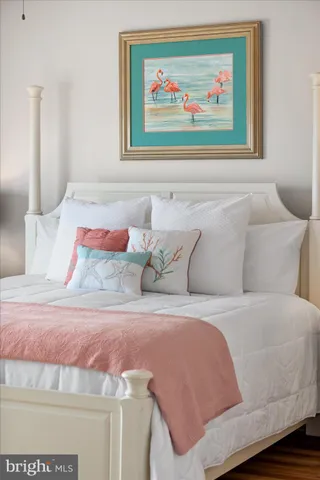 a spacious bathroom with a granite countertop sink a toilet and a mirror