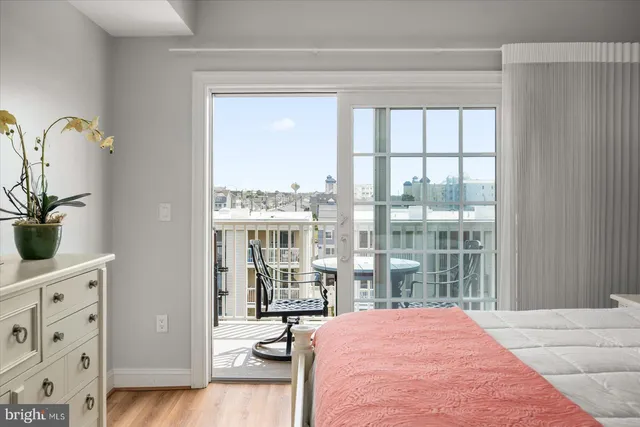 a en suite bathroom with a granite countertop sink and a mirror