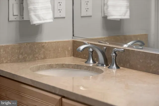 a view of a chairs and table in the balcony