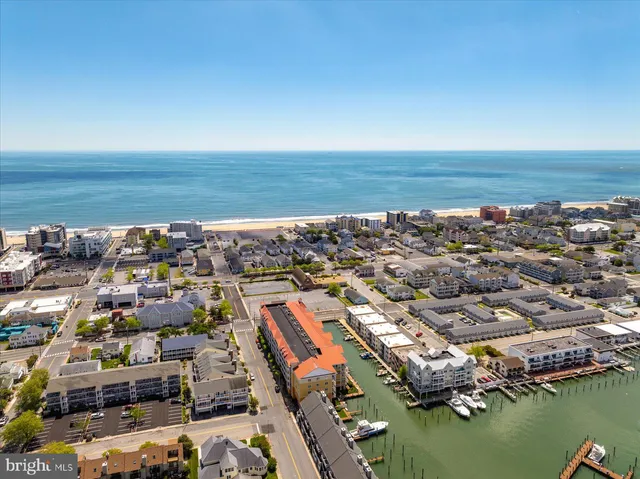 a view of a dining room with furniture wooden floor and chandelier