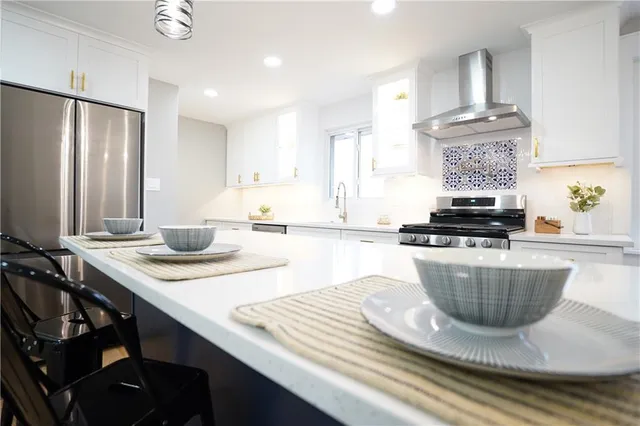 a kitchen with a sink and stove