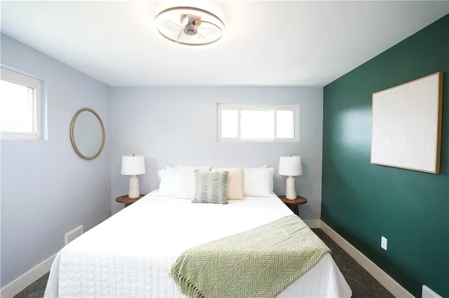 a bedroom with a bed and window