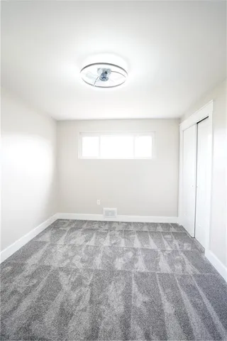 an empty room with a empty space and a window