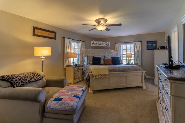 a bedroom with bed and window