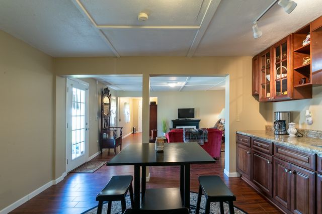 a bedroom with a bed and a mirror